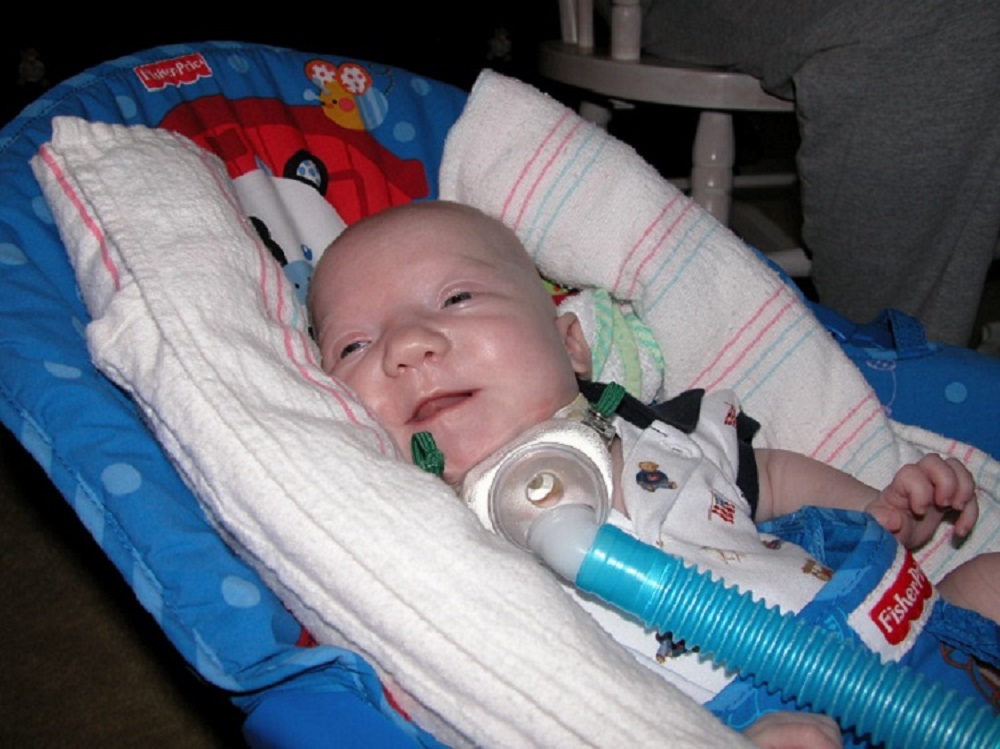 John flashes a smile during his lengthy stay at the Texas Children's NICU in 2005