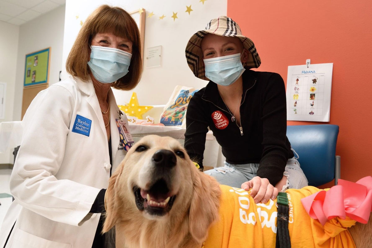 Texas Children’s Hospital’s first therapy dog, Elsa, visits a pediatric patient to help alleviate her anxiety and provide unconditional love