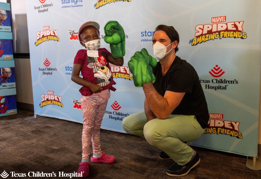 Jakeira “Kiki” Williams, 9, shows off her super hero pose alongside Armen Taylor, the voice of The Hulk on Marvel’s Spidey and His Amazing Friends on Disney Junior.
