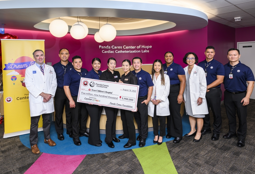 Texas Children's physicians pose with Panda Express team members for check presentation