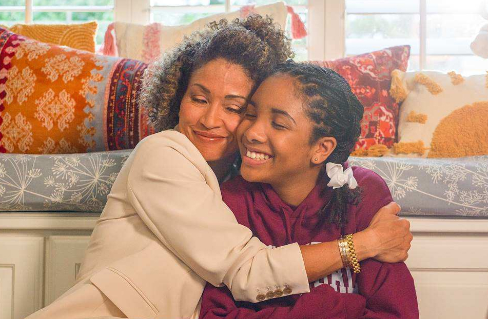 Mother and teenage daughter hugging