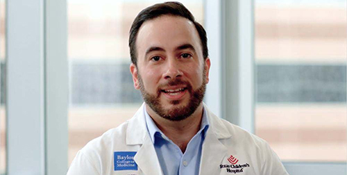 Dr. Daniel Davila-Williams talking during an interview.