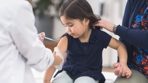 Girl getting vaccine