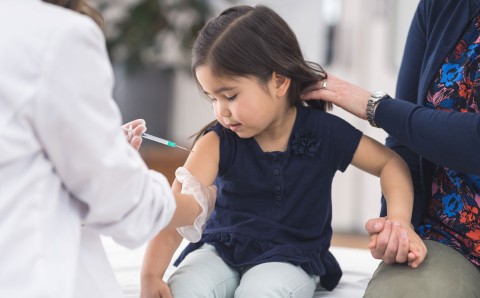 Girl getting vaccine