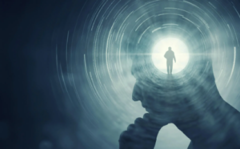 Photo depicting a figure walking inside of another person's mind.